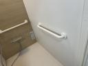 Installing a handrail on the right wall of the bathroom after renovation